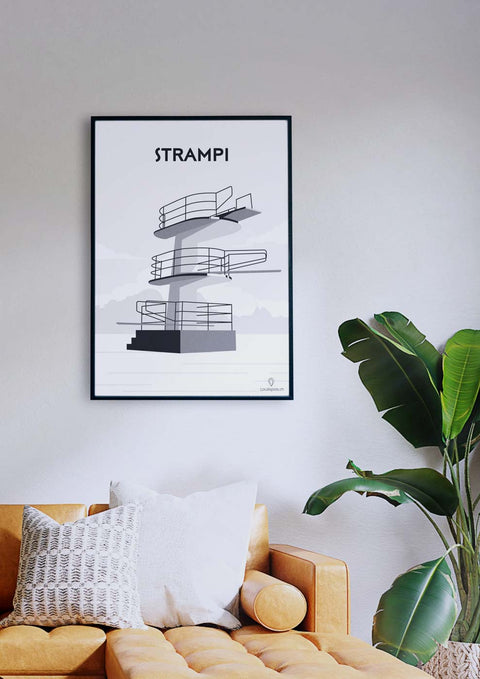 Ein Wohnzimmer mit Couch und einem Schwarz-Weiss-Poster von Strampi.